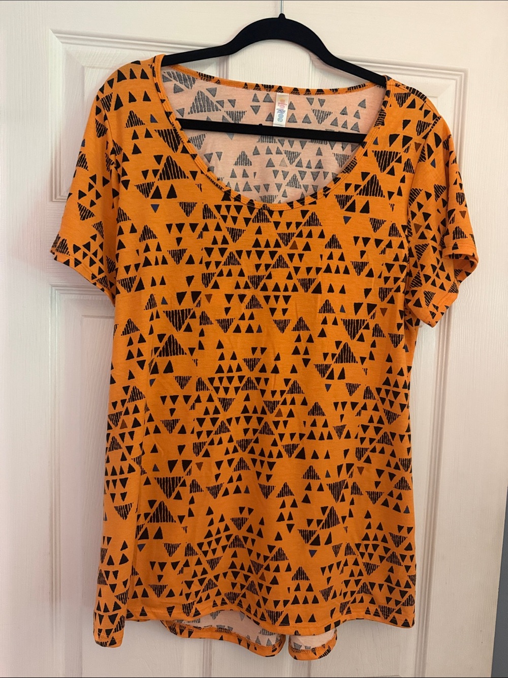 LuLaRoe Orange Scoop Neck Tee with Black Triangle Pattern
